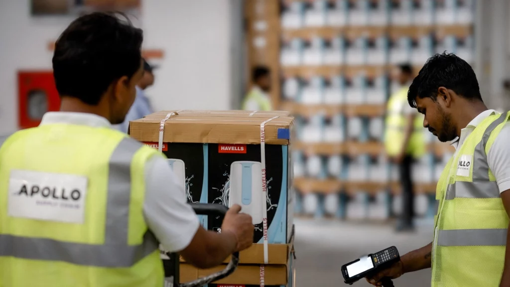 Warehouse executives managing client-site warehousing operations using handheld scanners and material handling equipment
